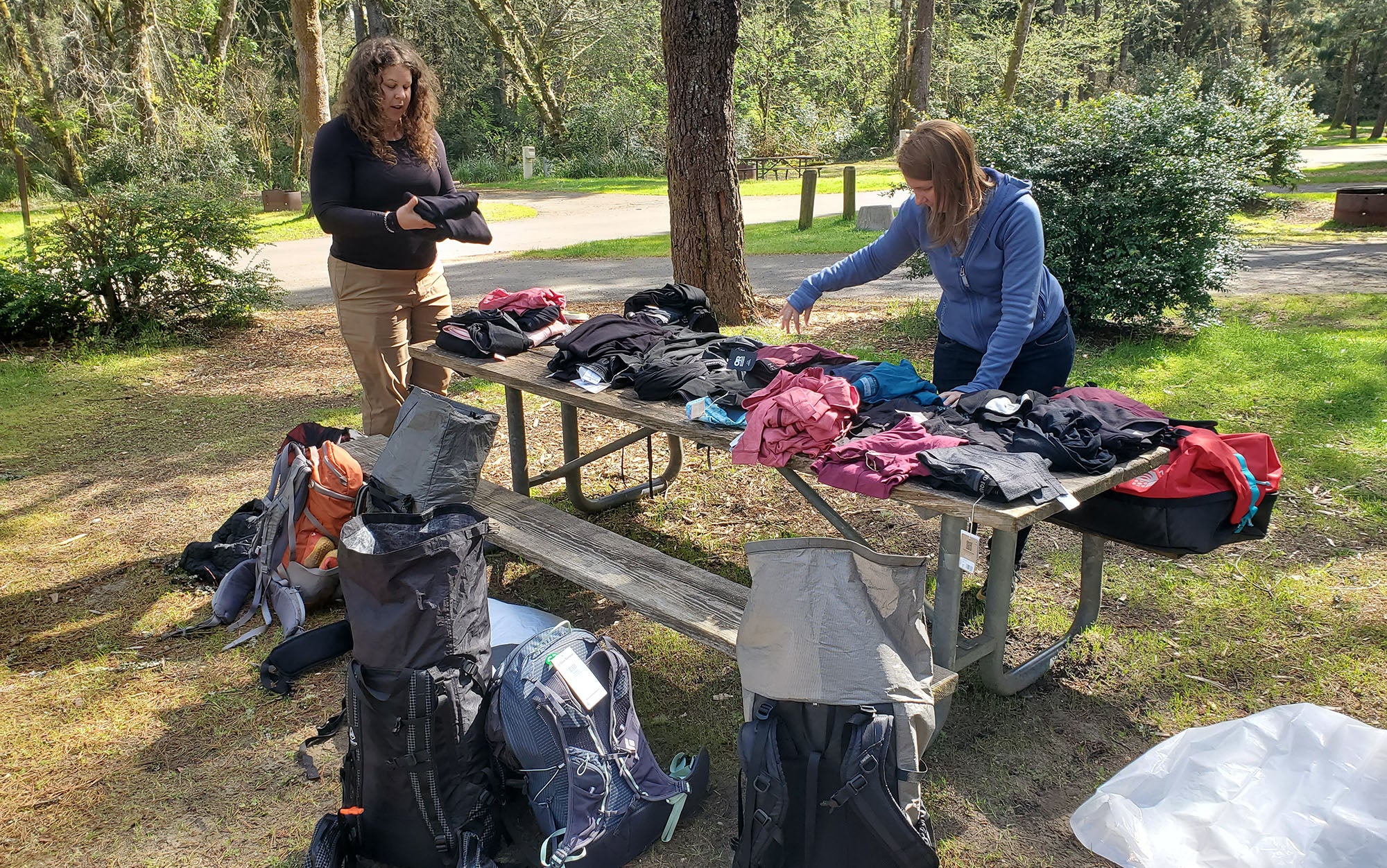 Two of our testers sorting thermal underwear for women at the start of our testing trip.